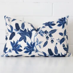 A hero shot of a floral rectangle cushion cover. It is made from a deluxe linen fabric.