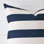 Enlarged shot of a square cushion cover that highlights that striped motif on its linen fabric.