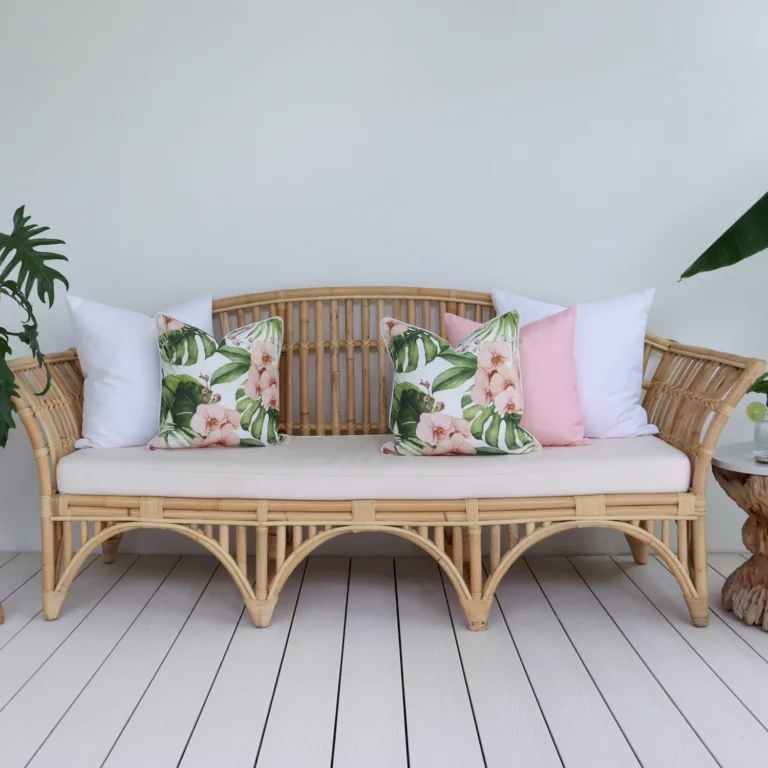 A comfy lounge with a set of 5 pink outdoor cushions inviting you to relax and unwind in tranquil surroundings.