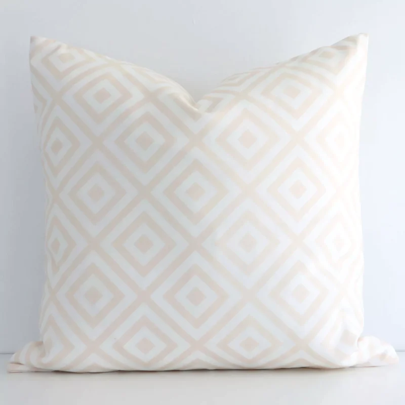 otama-geometric-waterproof-beige-outdoor-cushion-cover---sc690-45 Lovely square white and beige cushion positioned in front of white wall. Its geometric style pops on the outdoor fabric.