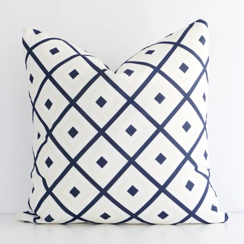 otama-geometric-waterproof-navy-beige-outdoor-cushion-cover---sc693-45 Macro shot showing the top left side of this square outdoor cushion. The navy and beige hue and geometric design are magnified.