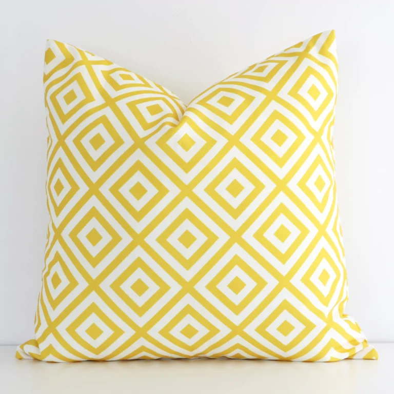 Vibrant yellow geometric cushion cover constructed from outdoor fabric and shown in a square shape.