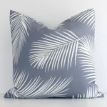 An alluring outdoor square cushion cover in grey. It features an attractive palm style.