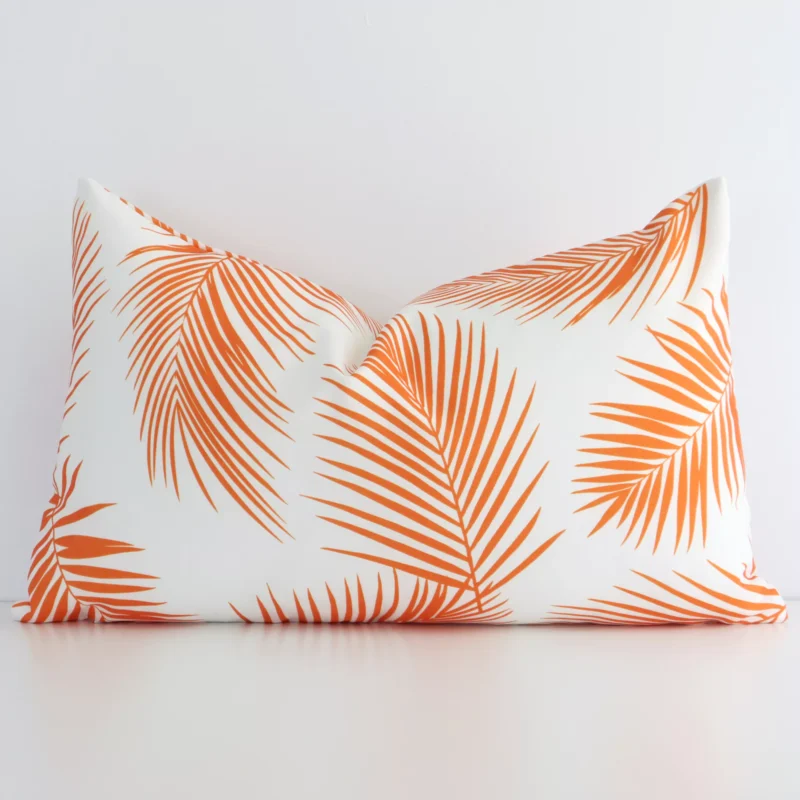 otama-palm-waterproof-rectangular-orange-outdoor-cushion-cover---rectangle---sc716-30 A lovely rectangle orange palm leaf printed cushion cover arranged in front of a white wall. The palm style complements the outdoor material.
