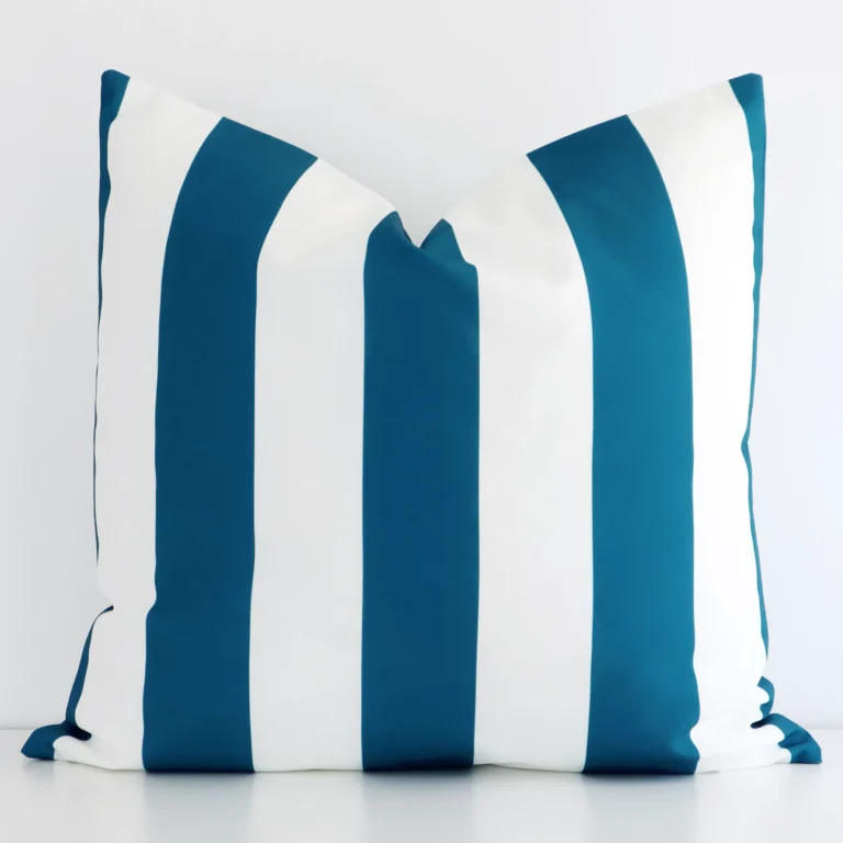 Front view of stripe large cushion. Crafted from a special outdoor material in a teal colour.
