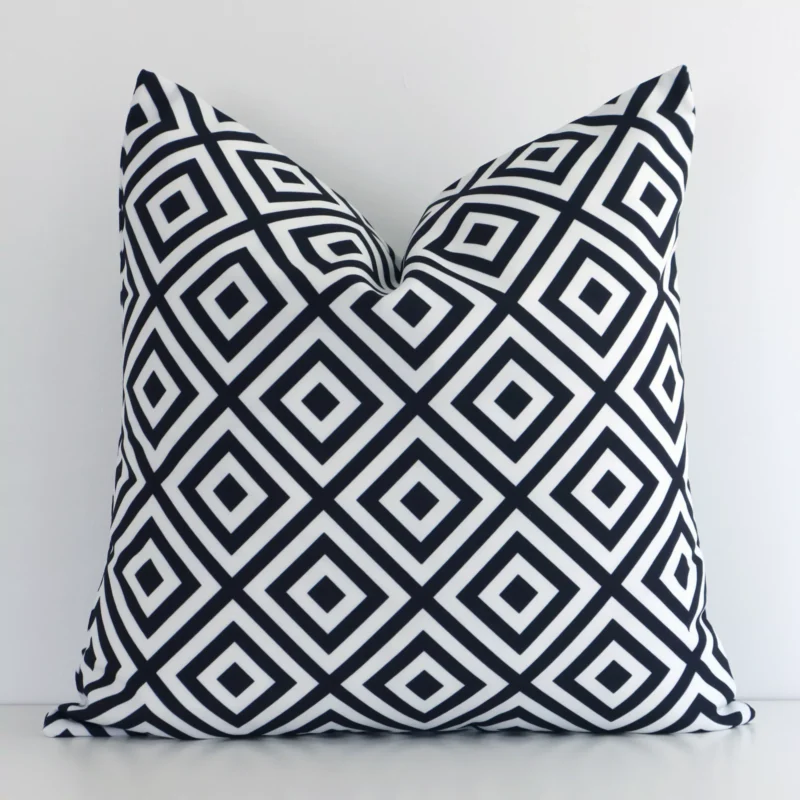 otama-waterproof-geometric-black-and-white-outdoor-cushion-cover---sc695-45 An attractive geometric outdoor cushion in front of a white wall. It has a square shape and is black-and-white in colour.