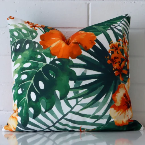 A bold floral outdoor cushion in a sleek square size with a red tone of colour.