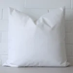 Front view of waterproof rectangle cushion. Crafted from a special outdoor material in a white colour.