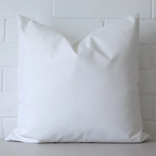 Front view of waterproof rectangle cushion. Crafted from a special outdoor material in a white colour.