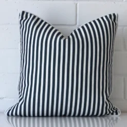 Vibrant navy blue striped cushion cover constructed from outdoor fabric and shown in a square size.