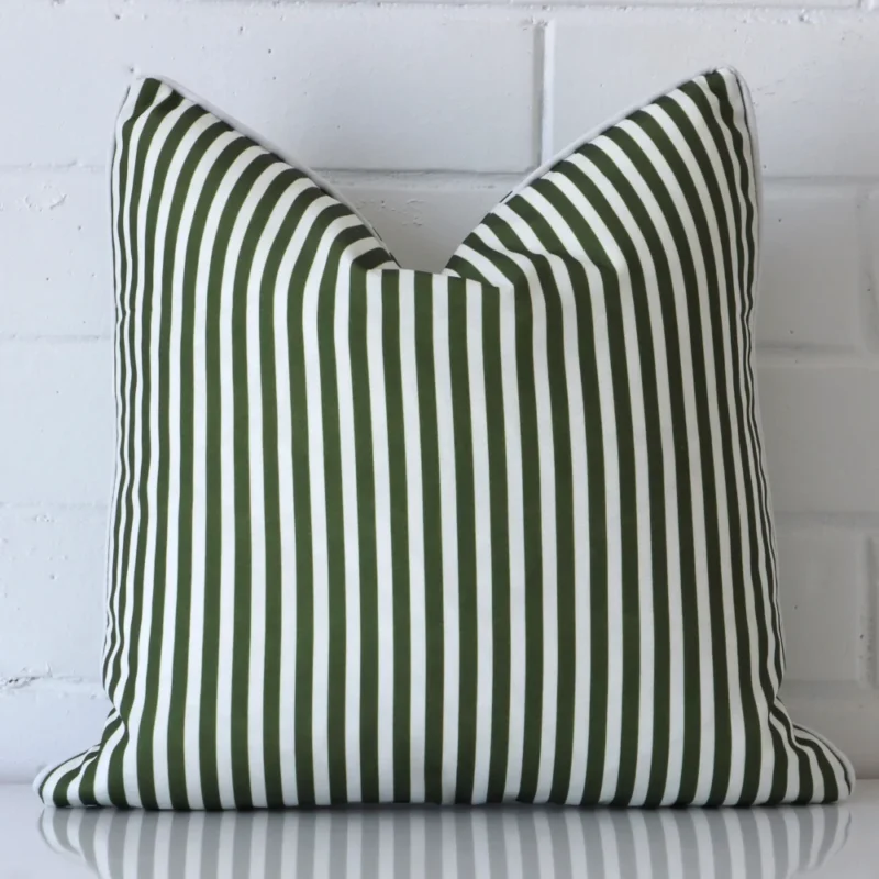 piha-olive-green-waterproof-striped-outdoor-cushion-cover-sc912-45 Here an olive green cushion is shown styled against a white wall. It has a square design and features a striped style.