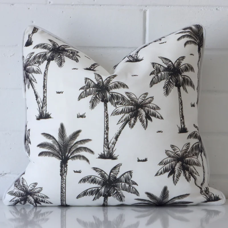 piha-palm-tree-waterproof-black-and-white-outdoor-cushion-cover-sc905-45 A brick wall that has a black and white cushion cover positioned in front of it. It has an exquisite outdoor material and a lovely square shape.