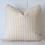 A hero shot of a square cushion cover. It is made from a deluxe outdoor fabric and features a beige colour.