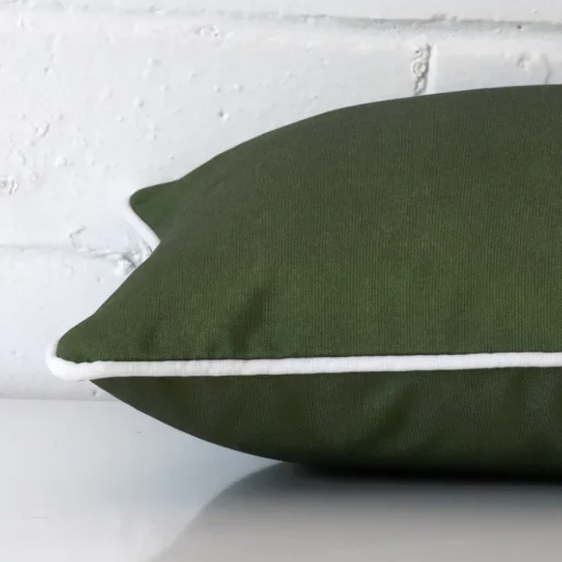 Horizontal edge view of front and back panels of an outdoor cushion in a rectangle size and with olive green colouring.
