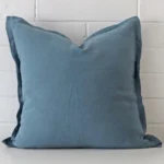 A stunning large linen cushion in a blue colour.