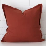 An alluring linen large cushion cover in terracotta.