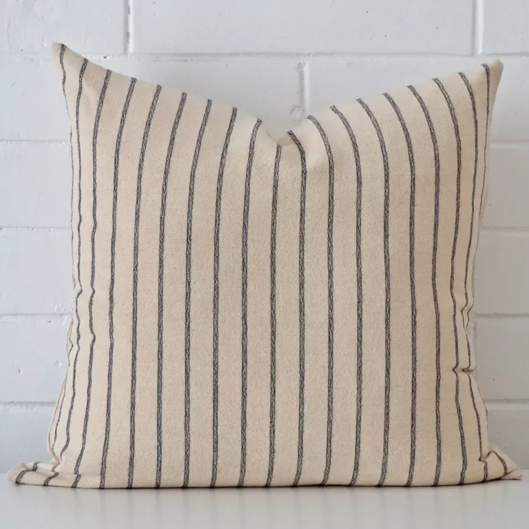 A bold striped designer cushion in a sleek large size.