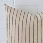 This image shows a large striped cushion cover from a very close range. The designer material are more clearly shown.