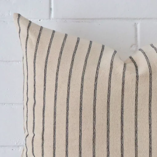 This image shows a large striped cushion cover from a very close range. The designer material are more clearly shown.