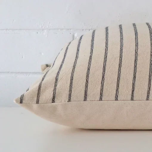 Side angle of striped cushion cover that has designer fabric and a large size.