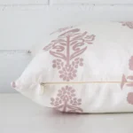 The seams of this linen square cushion is shown. The image shows the floral design and how the panels are attached.