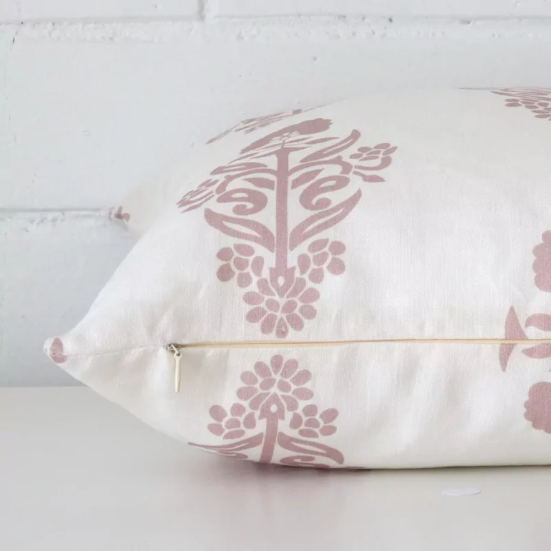 The seams of this linen square cushion is shown. The image shows the floral design and how the panels are attached.