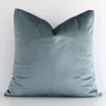 An alluring velvet square cushion cover in sage green. It features an attractive solid colour style.