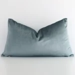 A charming solid-coloured velvet cushion in a sleek rectangular shape with a sage green tone of colour.
