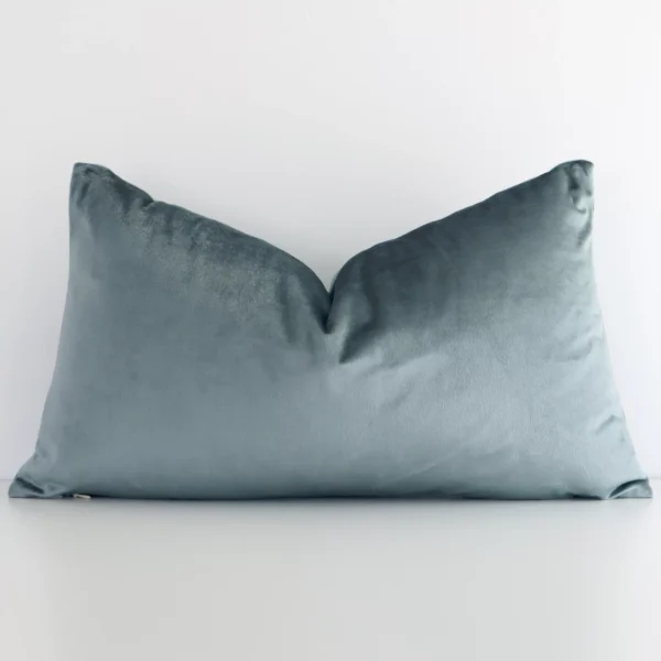 A charming solid-coloured velvet cushion in a sleek rectangular shape with a sage green tone of colour.