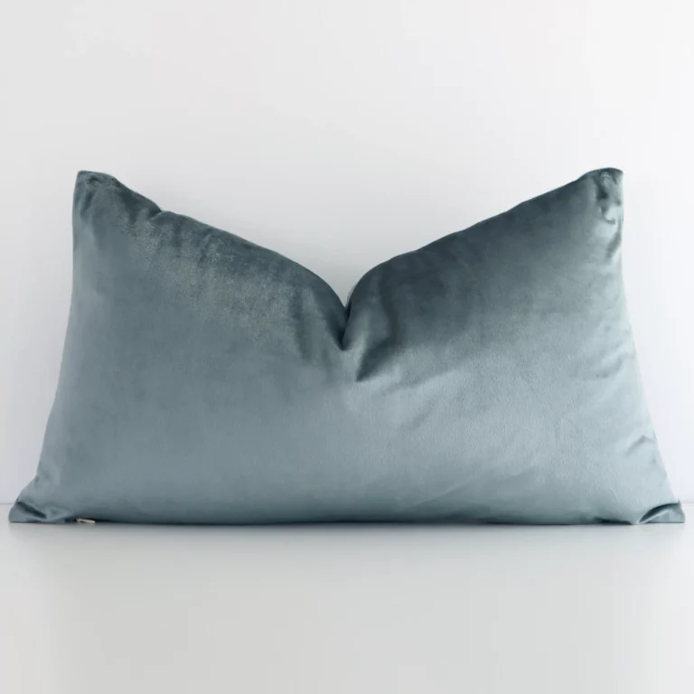 A charming solid-coloured velvet cushion in a sleek rectangular shape with a sage green tone of colour.