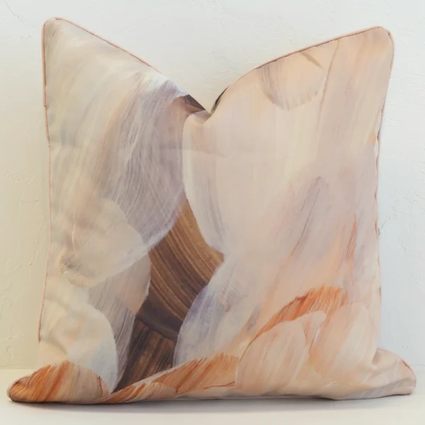 Striking brown outdoor cushion with abstract brush strokes in multiple earthy tones.
