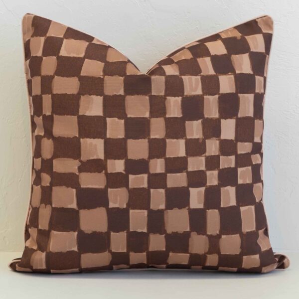 Sienna outdoor cushion with brown and beige checkered pattern.