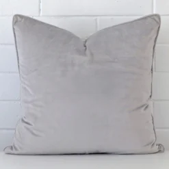 A hero shot of a large cushion cover. It is made from a deluxe velvet fabric and features a silver grey colour.