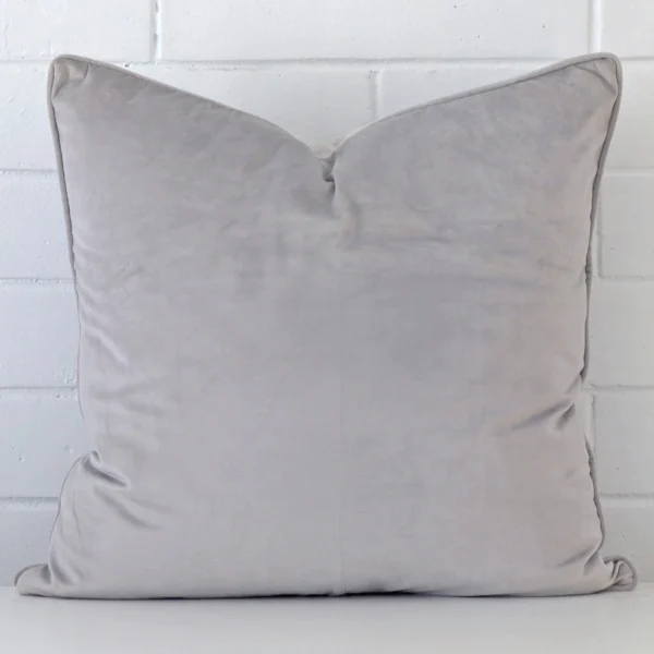 A hero shot of a large cushion cover. It is made from a deluxe velvet fabric and features a silver grey colour.