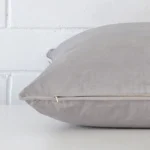 Enlarged image of the side of this silver grey velvet cushion. It has a large size.