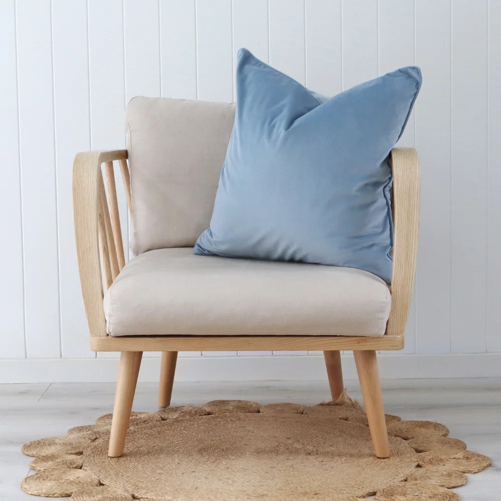 A single chair is showcasing a blue cushion.