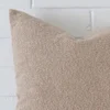 A boucle large cushion’s corner has been enlarged in this shot. The beige colour is shown up close.