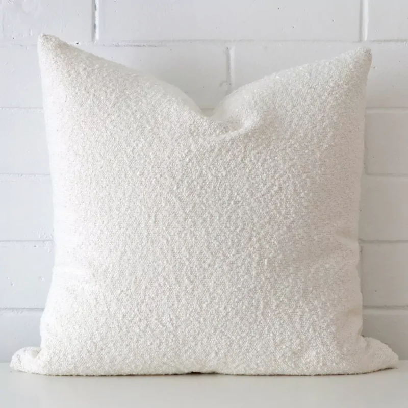 sofia-white-boucle-cushion-cover-large-sc1028-55 A hero shot of a boucle large cushion cover. It is made from a deluxe boucle fabric and features a white colour.