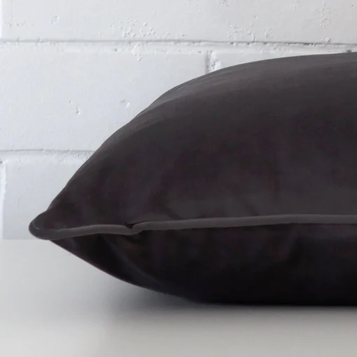 The seams of this velvet large cushion cover in space grey are shown.