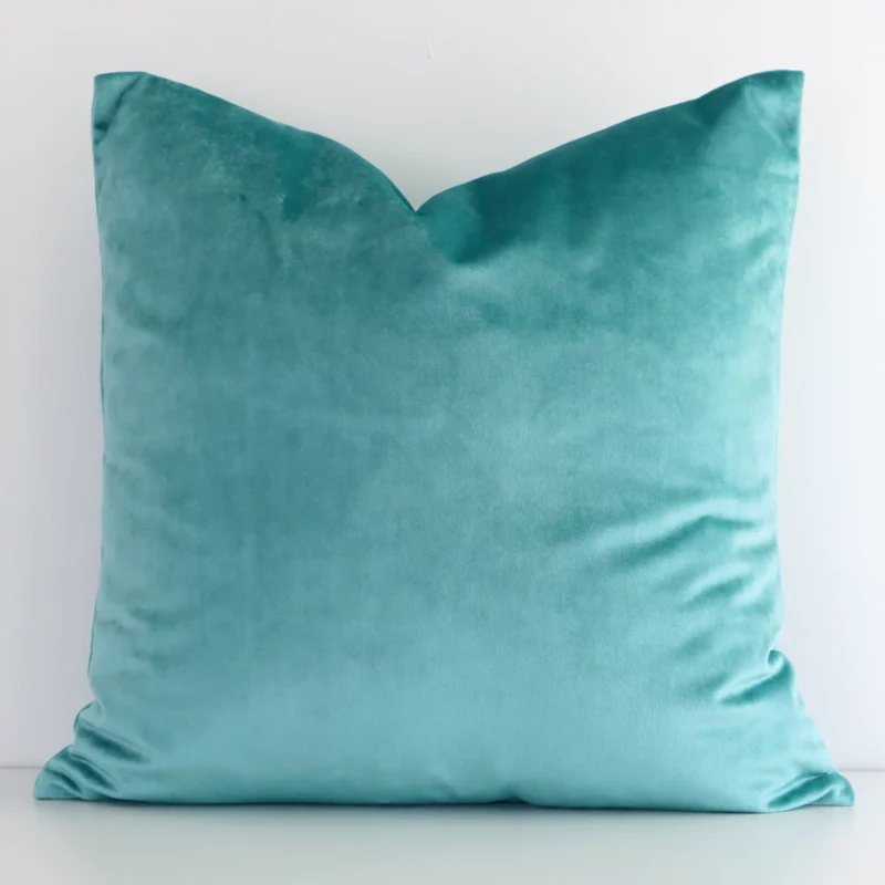 spearmint-velvet-linen-cushion-cover---sc512-45 A hero shot of a solid-coloured square cushion cover. It is made from a deluxe velvet fabric and features a spearmint colour.