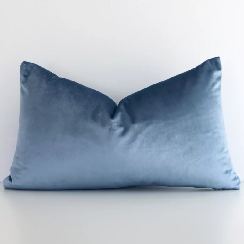 stone-blue-velvet-linen-rectangular-cushion-cover---30cm-x-50cm---sc505-30 A lovely rectangular stone blue cushion cover arranged in front of a white wall. The solid colour style complements the velvet material.