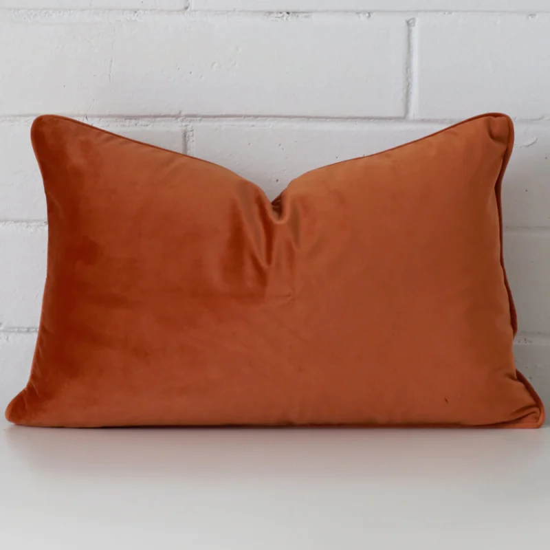 terracotta-velvet-rectangular-cushion-cover-30cm-x-50cm-sc770-30 A hero shot of a rectangle cushion cover. It is made from a deluxe velvet fabric and features a terracotta colour.