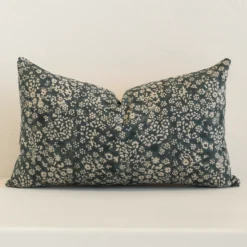 A graceful rectangle dark moss green cushion with a floral style on durable linen fabric.