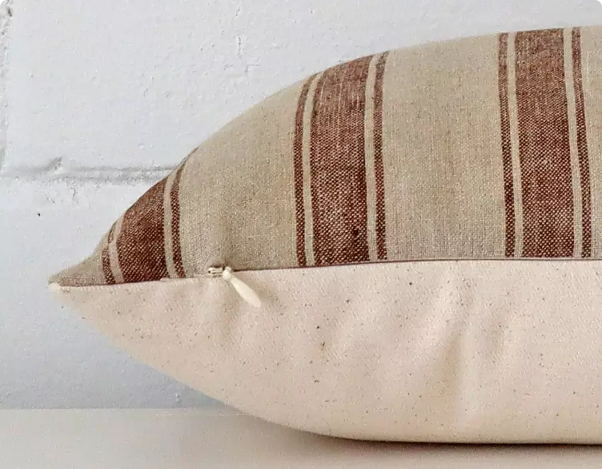 A close up view of the seam of a high end cushion showing the premium stitching.
