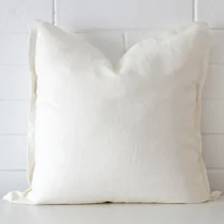 A graceful large white cushion made from a durable linen fabric.