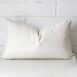 A stunning rectangle velvet cushion in a white colour.